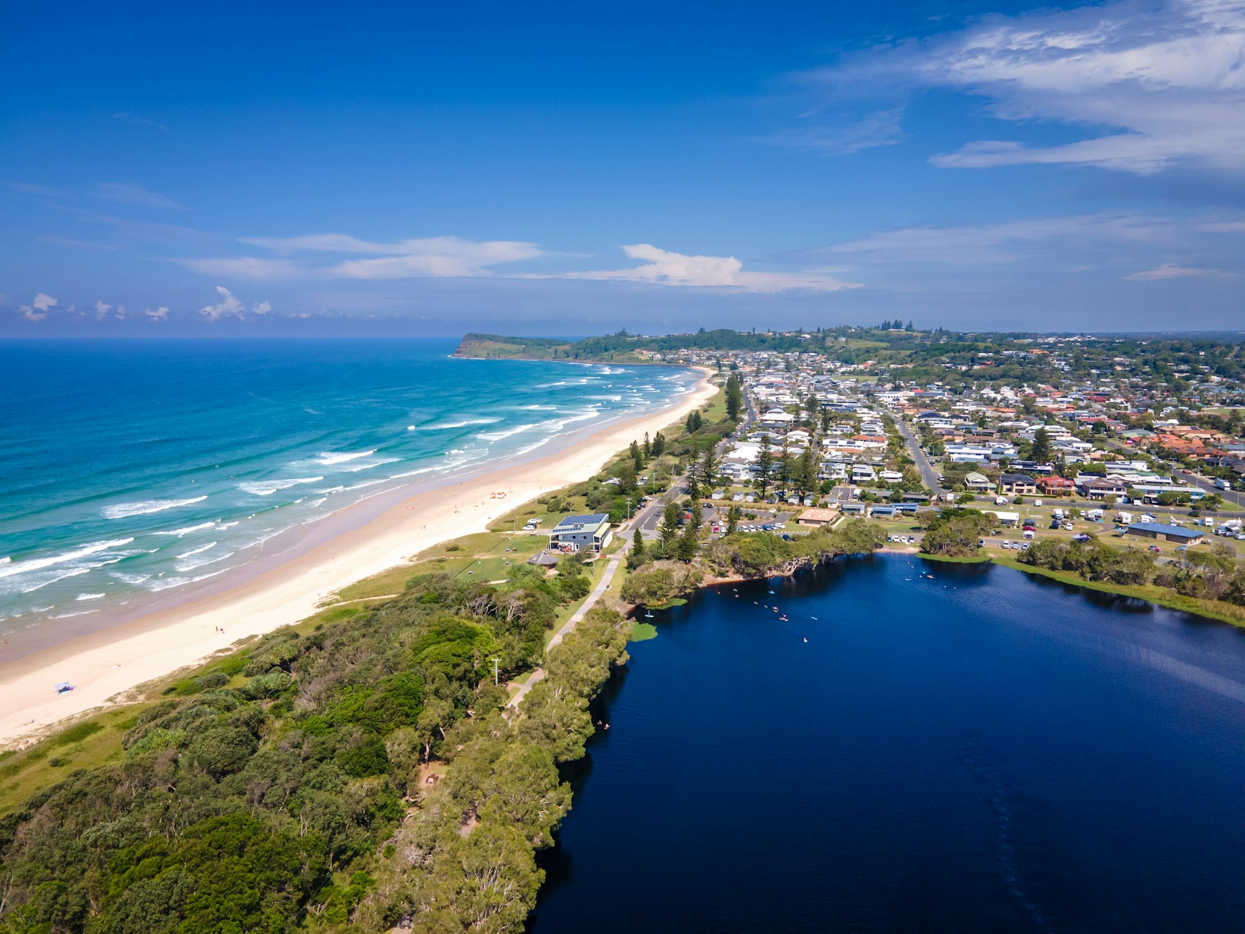 Aerial view of a coastline and suburbs