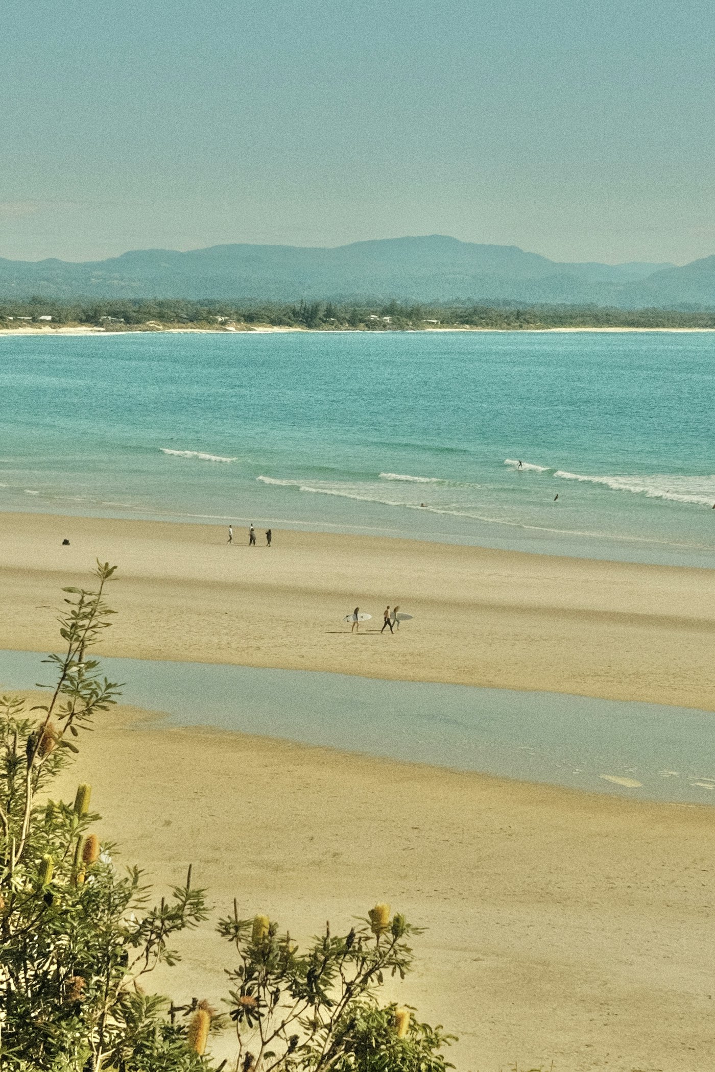 People walking along a beach