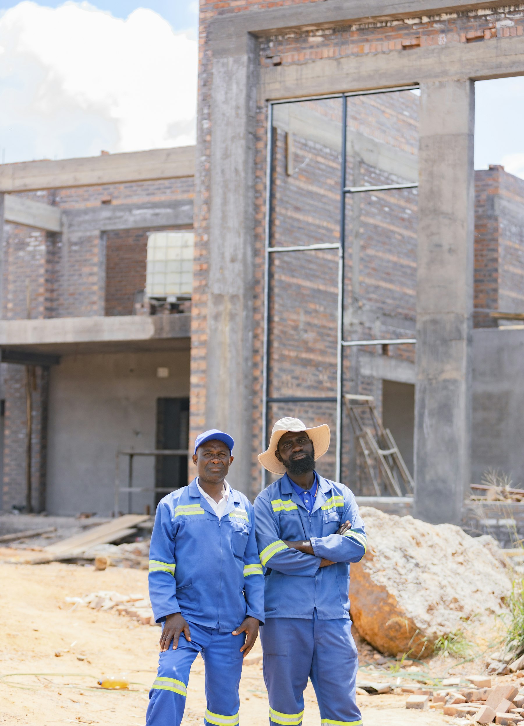 Builder laying bricks on a wall