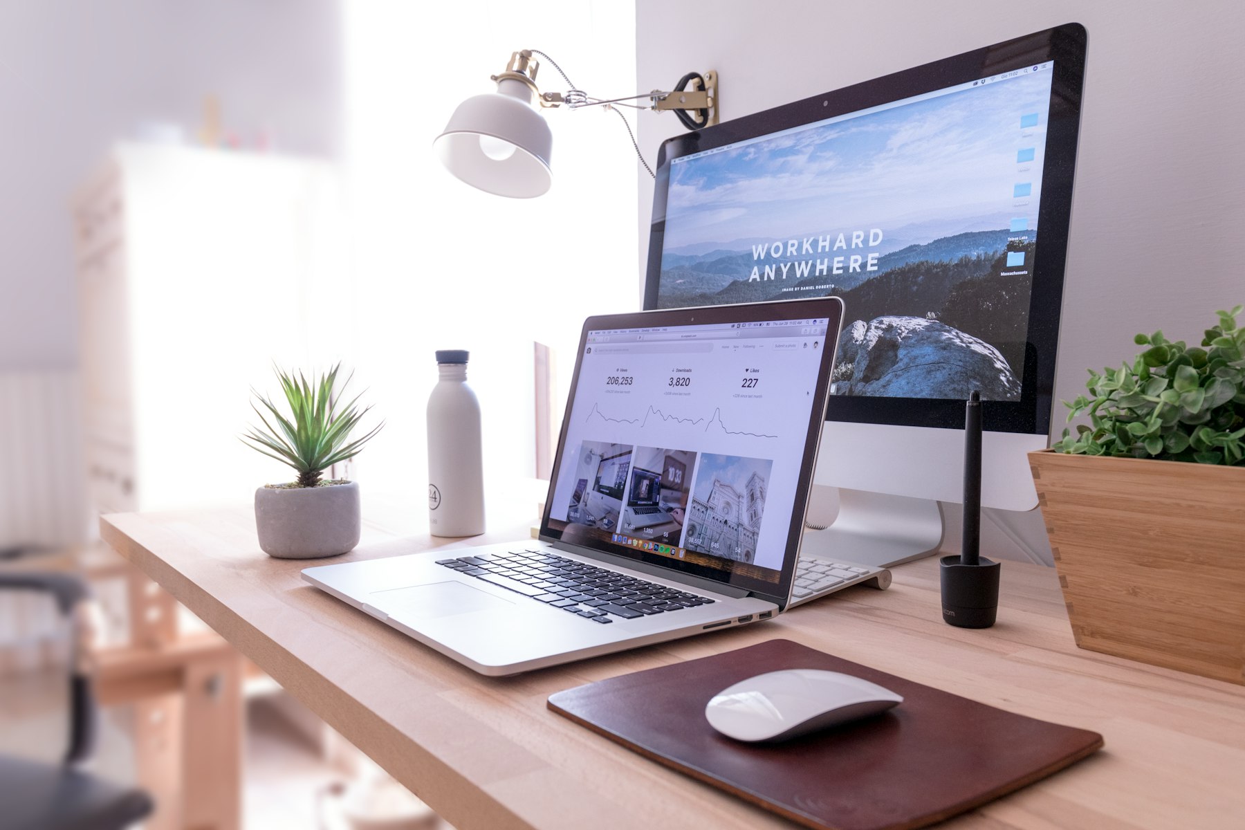 Web design desk with a large monitor and keyboard