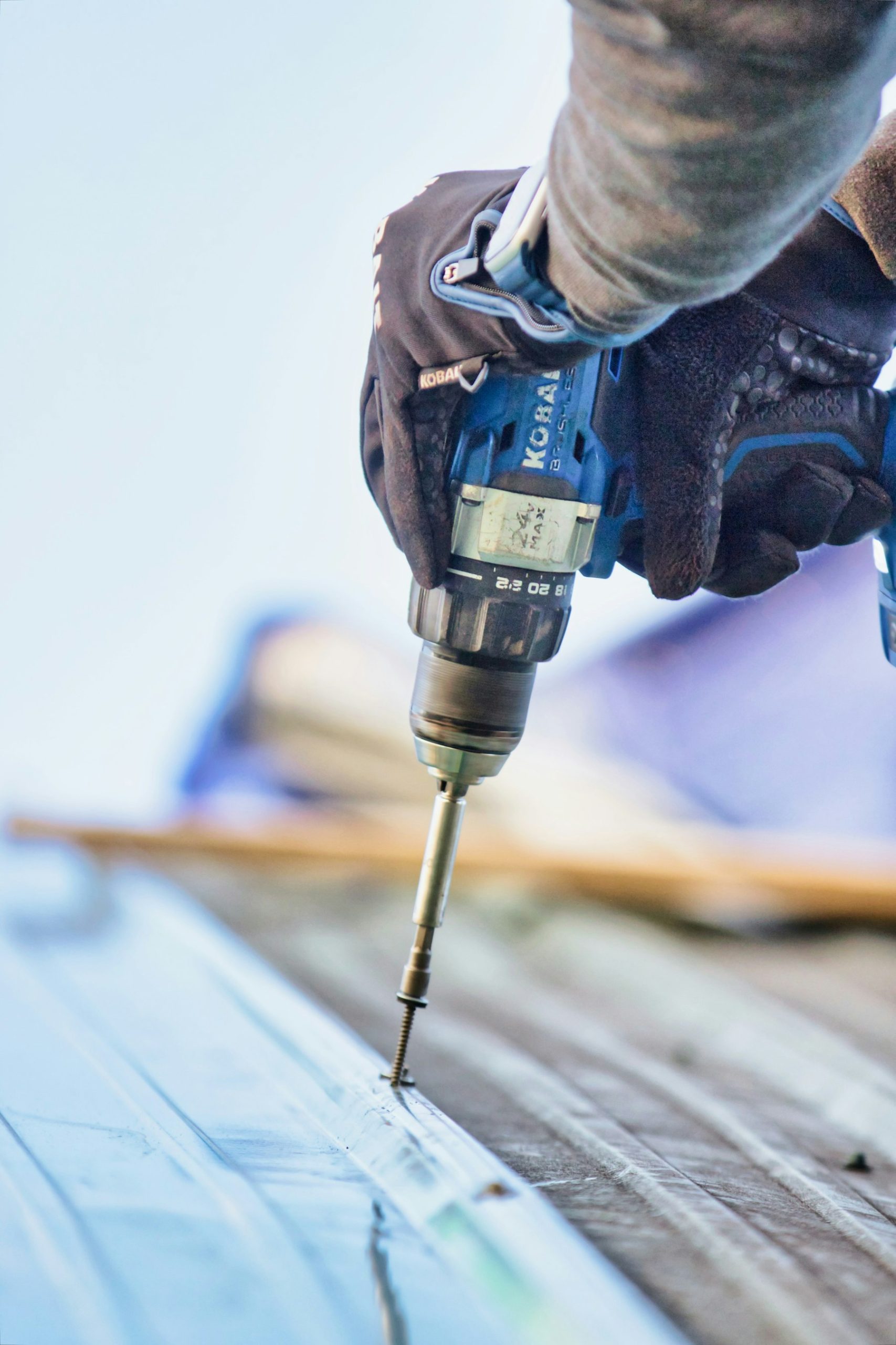 Cordless drill resting on a workbench