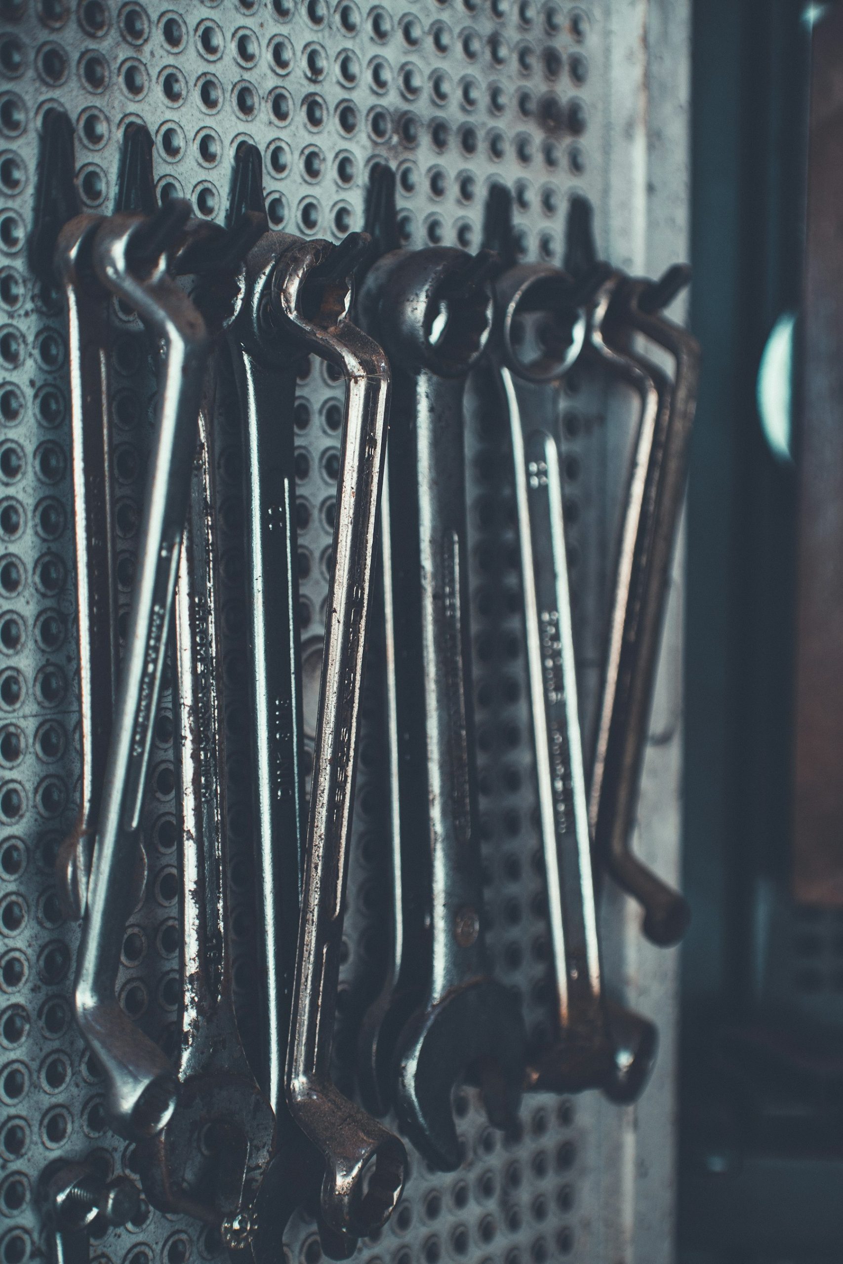 Set of wrenches laid out on a workbench